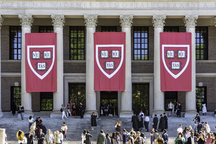 Harvard banners above the steps of Widener Library.