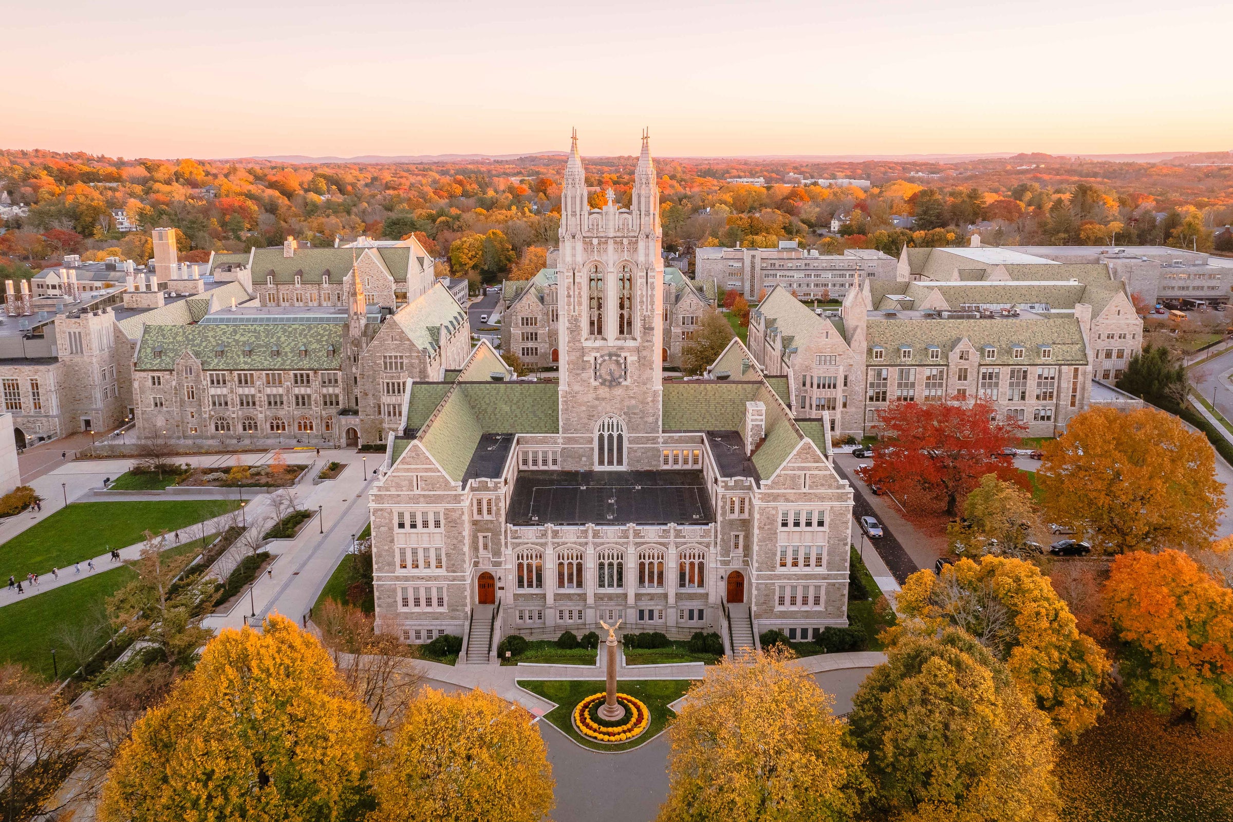 Boston College’s Gasson Hall surrounded by autumn trees.
