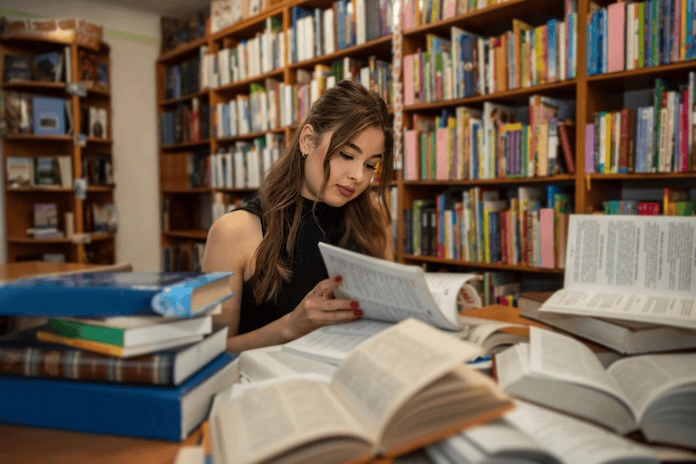 Student reading in a library